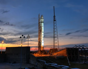 Rocket on the launch pad at sunset, representing Sunshine Welding's space-industry fabrication work