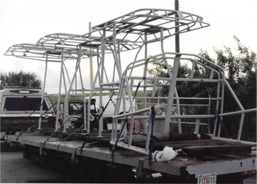 Aluminum T-top and tower frames staged on a flatbed trailer