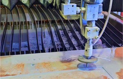 Waterjet cutter shaping steel plate underwater